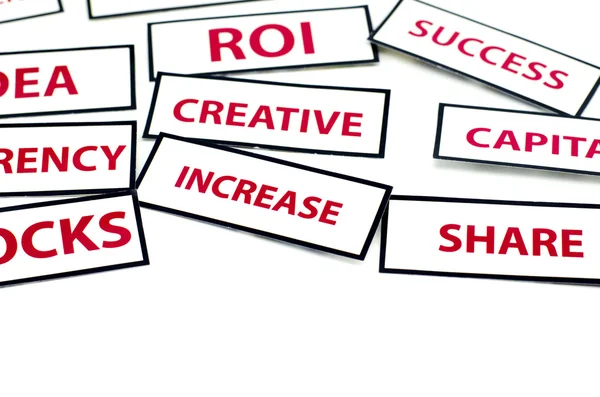 Business motivatie word idee, Roi, valuta, creatief, voorraden en verhoging afgedrukt op papier — Stockfoto