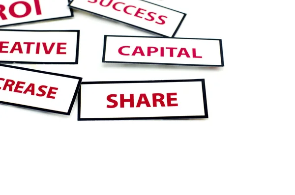 Business motivatie word hoofdstad, en aandeel gedrukt op papier met rode kleur — Stockfoto
