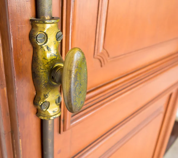 The Vintage wooden window with gold iron locked bolt — Stock Photo, Image