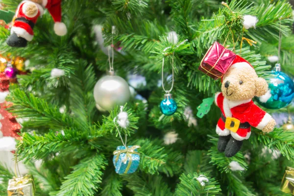 The Christmas tree with Santa doll and gift box — Stock Photo, Image