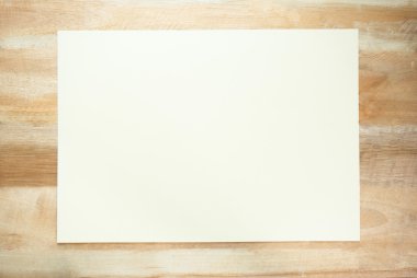 Top view of white paper note on the wood table