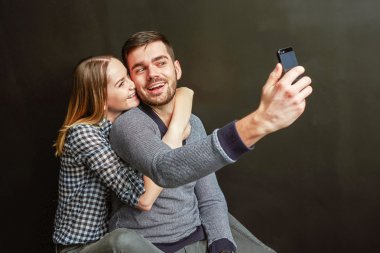 Couple making a funny selfie