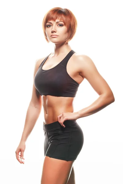 Spor giyim Kızıl saçlı kadın portresi. Stüdyo vurdu