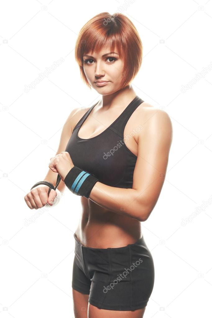 Young redhead female athlete wearing straps