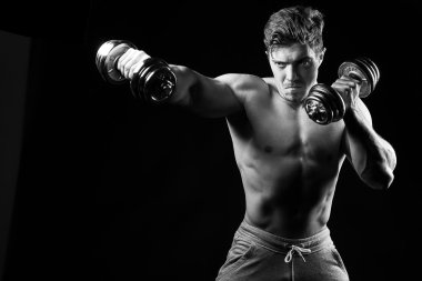 Sexy muscular fitness man. Black and white image.  clipart