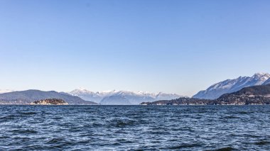 A view looking north up the Howe Sound towards Squamish, with snow-capped mountains and a windy morning on the Georgia Straight, British-Columbia