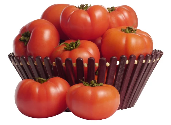 Tomates mûres dans un panier sur fond blanc Photos De Stock Libres De Droits