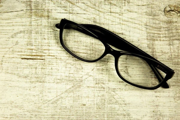 Glasses on an old wooden countertop — Stock Photo, Image