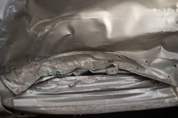 Damaged metal. Shooting a dent on a car after an accident. — Stock Photo, Image