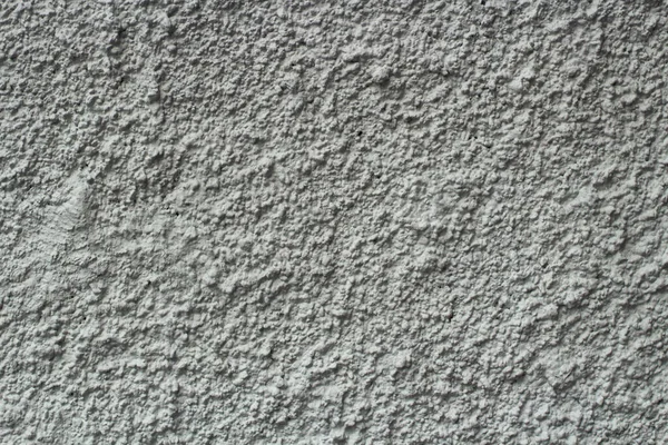 壁に石膏のテクスチャ 壁は詳細です 粗白色の表面 背景を覆うシンプルな壁 — ストック写真