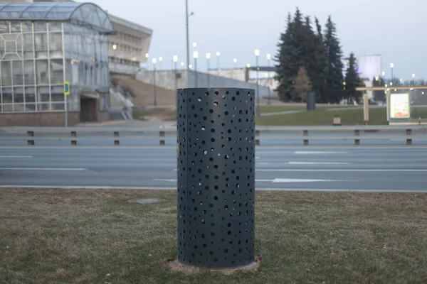 Underground ventilation on the street. The ventilation shaft in the city. Pipe to divert heat from underground infrastructure.