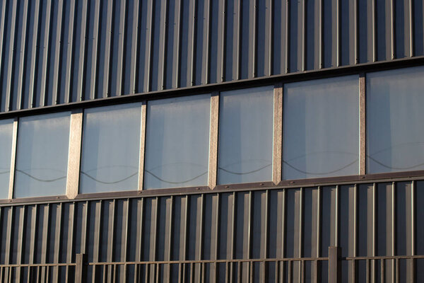 Windows in an office building. industrial architecture. Elements of modern design of production buildings.