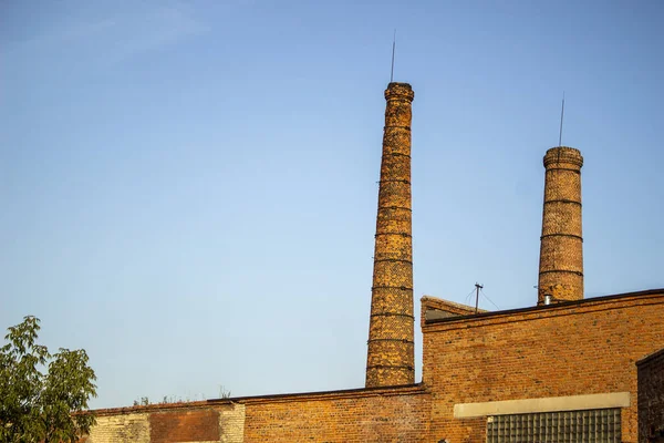 Brick pipe. Old factory building. Brick building. The architectural structure.