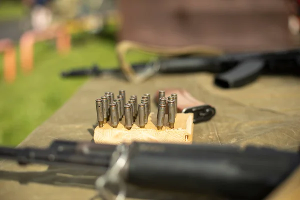 Firearms for training. The machine is on the table. Reliable small arms. Details of military training.