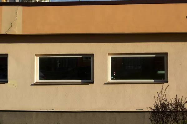 The wall of the building. The surface of the wall of the house. Construction of materials.