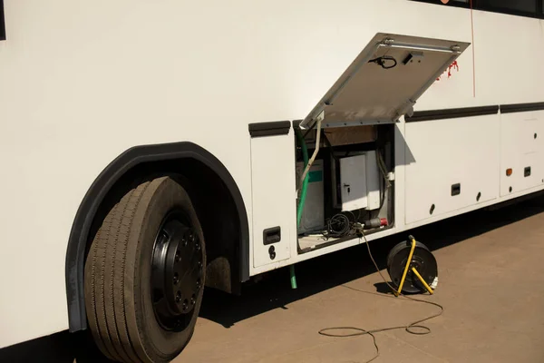 Broken bus. Public transport battery charging. A bus with an unfolded wheel.