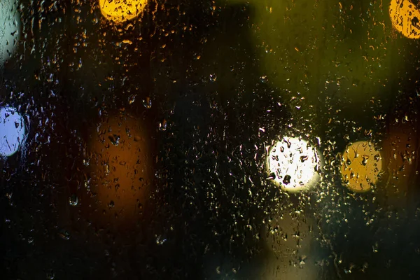 Regentropfen Auf Dem Glas Unscharfer Hintergrund Mit Lichtern Die Textur — Stockfoto
