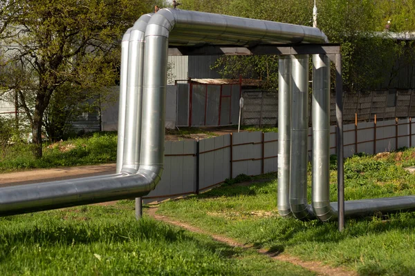 Heating pipes on the surface. Hot water supply. The heating main is covered with stainless steel.