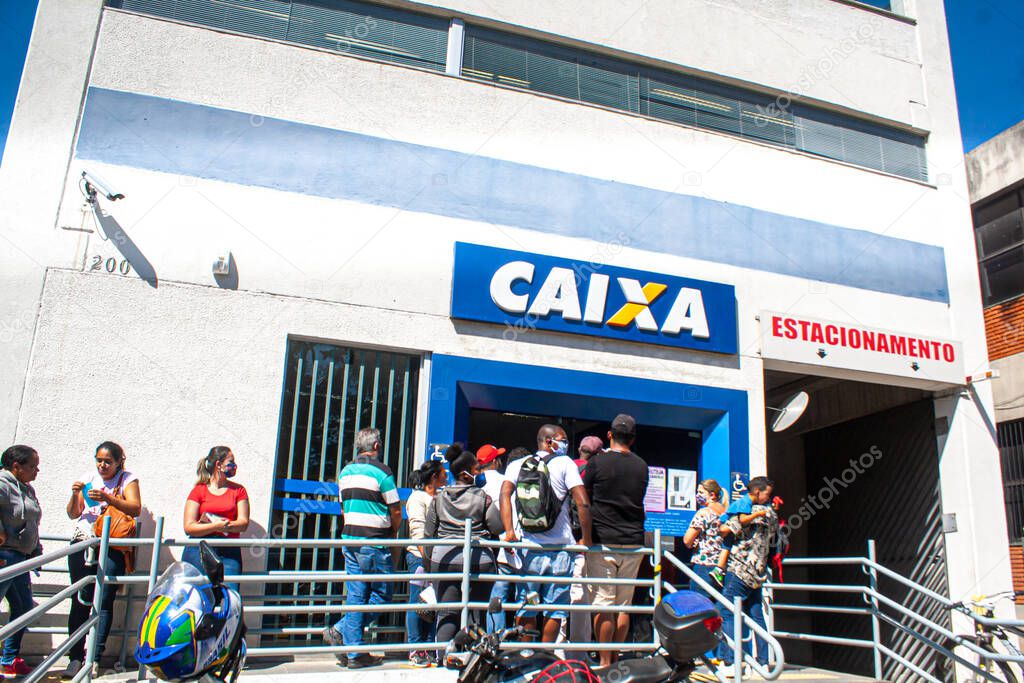 (INT) Covid-19:Emergency aid.April 29,2020,Cotia,Sao Paulo,Brazil:People face a queue at a bank branch of Caixa Economica Federal (CEF) in Granja Vianna in the city of Cotia, Sao Paulo, this Wednesday, 29, due to the possibility of withdrawing the em