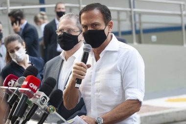  Brezilya Sağlık Bakanlığı 'na CORONONAVAC Aşısı teslimatı. 29 Mart 2021, Sao Paulo, Brezilya: Sao Paulo Valisi Joao Doria, 5 milyondan fazla Butantan Enstitüsü aşısının teslimatı için düzenlenen törene katıldı. 