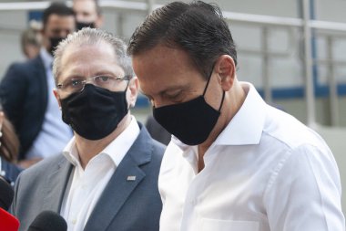  Brezilya Sağlık Bakanlığı 'na CORONONAVAC Aşısı teslimatı. 29 Mart 2021, Sao Paulo, Brezilya: Sao Paulo Valisi Joao Doria, 5 milyondan fazla Butantan Enstitüsü aşısının teslimatı için düzenlenen törene katıldı. 