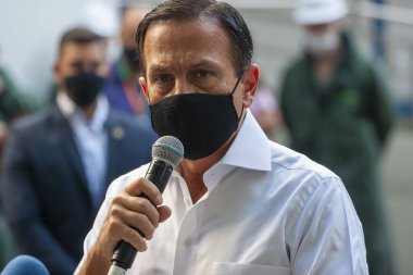  Brezilya Sağlık Bakanlığı 'na CORONONAVAC Aşısı teslimatı. 29 Mart 2021, Sao Paulo, Brezilya: Sao Paulo Valisi Joao Doria, 5 milyondan fazla Butantan Enstitüsü aşısının teslimatı için düzenlenen törene katıldı. 