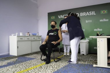 Sao Paulo Valisi Joao Doria 'ya Coronavac aşısı yapıldı. 7 Mayıs 2021, Sao Palo, Brezilya. Sao Paulo valisi Joao Doria (PSDB) ve First Lady Bia Doria, bir doz Coronavac alır.