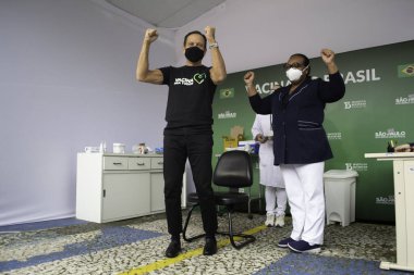 Sao Paulo Valisi Joao Doria 'ya Coronavac aşısı yapıldı. 7 Mayıs 2021, Sao Palo, Brezilya. Sao Paulo valisi Joao Doria (PSDB) ve First Lady Bia Doria, bir doz Coronavac alır.