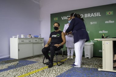 Sao Paulo Valisi Joao Doria 'ya Coronavac aşısı yapıldı. 7 Mayıs 2021, Sao Palo, Brezilya. Sao Paulo valisi Joao Doria (PSDB) ve First Lady Bia Doria, bir doz Coronavac alır.