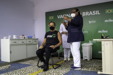 Sao Paulo Valisi Joao Doria 'ya Coronavac aşısı yapıldı. 7 Mayıs 2021, Sao Palo, Brezilya. Sao Paulo valisi Joao Doria (PSDB) ve First Lady Bia Doria, bir doz Coronavac alır.