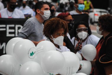 Sao Paulo 'da profesyonel hemşireler protesto yapıyor. 12 Mayıs 2021, Sao Paulo, Brezilya: Bu kategorideki hemşireler ve sendikalar Paulista Bulvarı 'nda protesto düzenlediler 