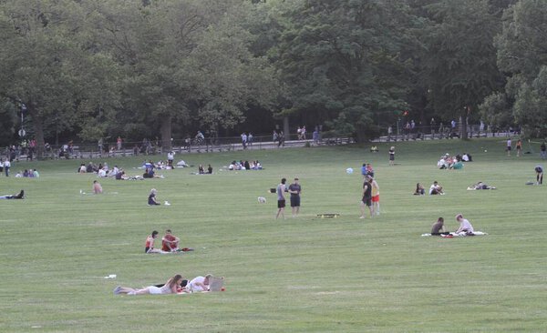 (NEW) New Yorkers Crowd Central Park Lawn. June 17, 2021, New York, USA: New Yorkers and tourists are seen crowding up Central Park lawn on a sunny day, having picnics, dancing, playing sports, reading novels and enjoying love time with their partner