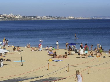 June 30, 2021, Cascais, Portugal: Movement of bathers at Conceicao beach, in  district of Cascais, on Wednesday (30). Due to abundance of wind, place is much sought after by surfers