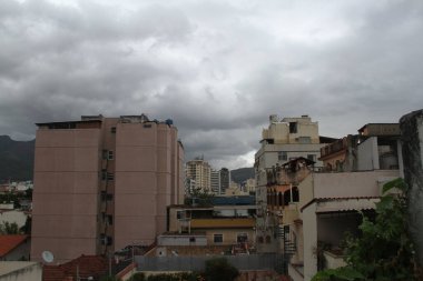 Cloudy weather in Rio de Janeiro. June 30, 2021, Rio de Janeiro, Brazil: A sudden change of weather in Cachambi area of  Rio de Janeiro from being hot to cold with a cloudy sky ready to rain. The weather forecast shows 19C 