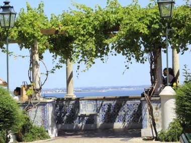 Movement at Santa Luzia Viewpoint, in Lisbon. July 4, 2021, Lisbon, Portugal: Movement at Santa Luzia Viewpoint, one of the main tourist attractions in Lisbon, which has a panoramic and spectacular view of the city, on Sunday (4).