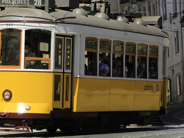 Tourist movement on cable car 28, in Lisbon. July 4, 2021, Lisbon, Portugal: Movement of tourists on cable car 28, the most charming in Lisbon, which runs through the various tourist attractions of the city, on Sunday, June (4)