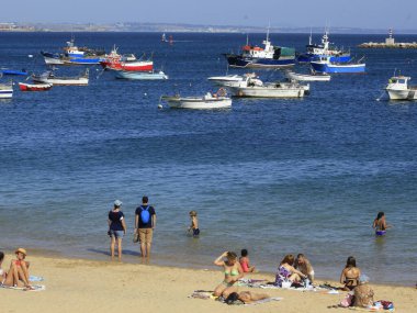 Bathers movement on Ribeira beach, in Cascais. July 29, 2021, Cascais, Portugal: Sunny day with pleasant temperature takes bathers to Ribeira beach, which is in center of Cascais, in metropolitan region of Lisbon, on Thursday (29).  