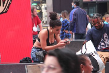  NYPD arrest a man who shouts shame on you at naked entertainers at Time Square. July 29, 2021, New York, USA: A man who was shouting shame on you at naked female entertainers and cowgirl for their exposition at Times Square 
