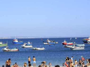 Bathers movement on Ribeira beach, in Cascais. July 29, 2021, Cascais, Portugal: Sunny day with pleasant temperature takes bathers to Ribeira beach, which is in center of Cascais, in metropolitan region of Lisbon, on Thursday (29).  