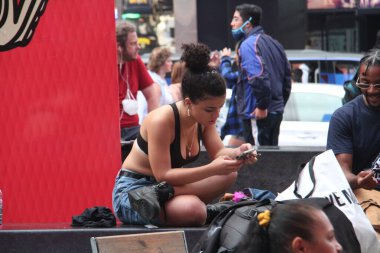  NYPD arrest a man who shouts shame on you at naked entertainers at Time Square. July 29, 2021, New York, USA: A man who was shouting shame on you at naked female entertainers and cowgirl for their exposition at Times Square 