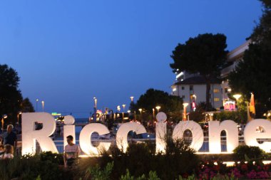 Public during Night Rose festivities in Emilia Romagna region. July 31, 2021, Riccione, Italy: Public follows Night Rose festivities, in Emilia Romagna region, northern Italy, known for its rich cuisine and seaside resorts. 