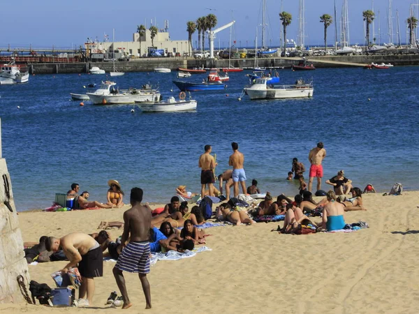 Bathers movement on Ribeira beach, in Cascais. July 29, 2021, Cascais, Portugal: Sunny day with pleasant temperature takes bathers to Ribeira beach, which is in center of Cascais, in metropolitan region of Lisbon, on Thursday (29).  