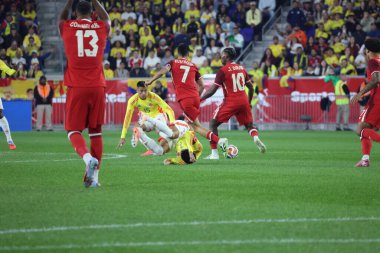 (SPO) Colombia vs Canada friendly Soccer Game. October 14, 2025, Harrison, New Jersey, USA: Canada's S. Eustaquio #7 and J. David #10 and Colombia's L.Dias #7 and J. Portilla #15 in a ball dispute during a high-level friendly international soccer 