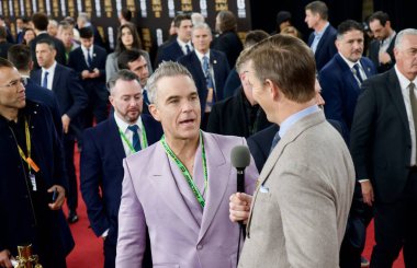 Washington 'daki John F. Kennedy Center' da Kırmızı Halı FIFA Dünya Kupası final kurayı. 5 Aralık 2025, Washington DC, Maryland, ABD: Robbie Williams, FIFA Dünya Kupası Final Draw sırasında İngiliz şarkıcı ve söz yazarı. (niyi fote\ theenews2)