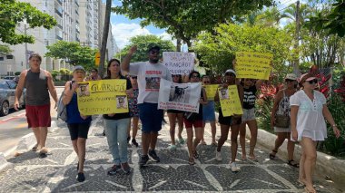 Guaruja (SP), Brezilya 01 / 02 / 2026 - Brezilya ve Guaruja 'da halk adaletin yerini bulması için Praca das Bandeiras' ta bir etkinlik düzenledi. (Oslaim Brito / Tenews2)