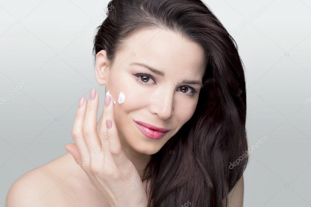 Gorgeous woman face cream