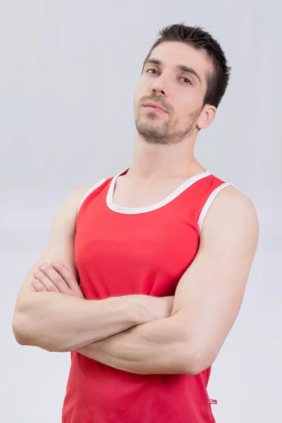 Fit man posing in red — Stock Photo, Image