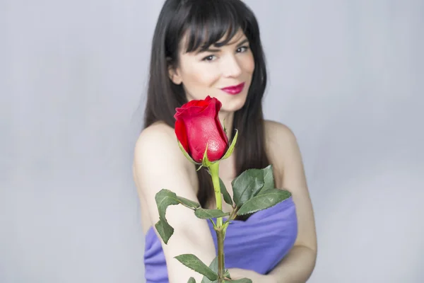 Girl and a rose — Stock Photo, Image