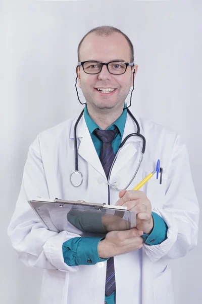 Happy doctor in studio Royalty Free Stock Images
