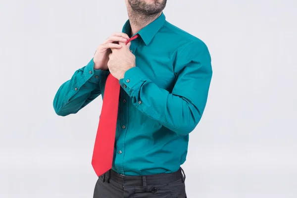 Man adjusting his tie — Stock Photo, Image